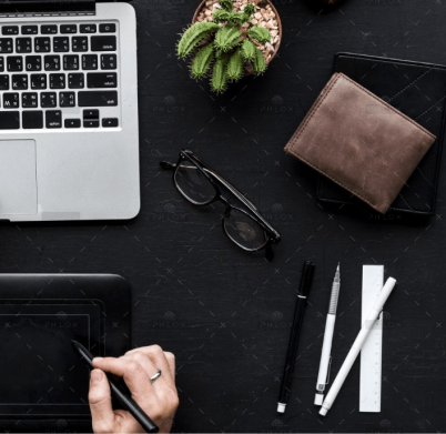 demo-attachment-1564-aerial-view-of-hands-working-with-computer-laptop-PCD9TQ7@2x